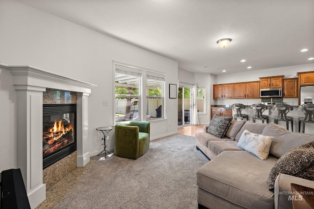 4902 N Schubert Ave, Meridian, ID 83646 - living room with a premium fireplace, baseboards, recessed lighting, and light colored carpet
