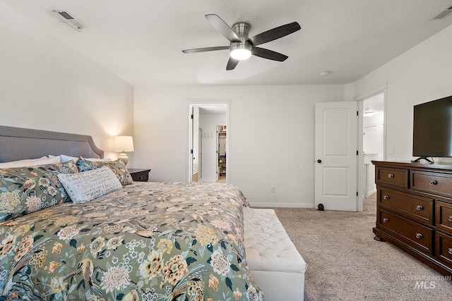 4902 N Schubert Ave, Meridian, ID 83646 - bedroom with light carpet, baseboards, and a ceiling fan