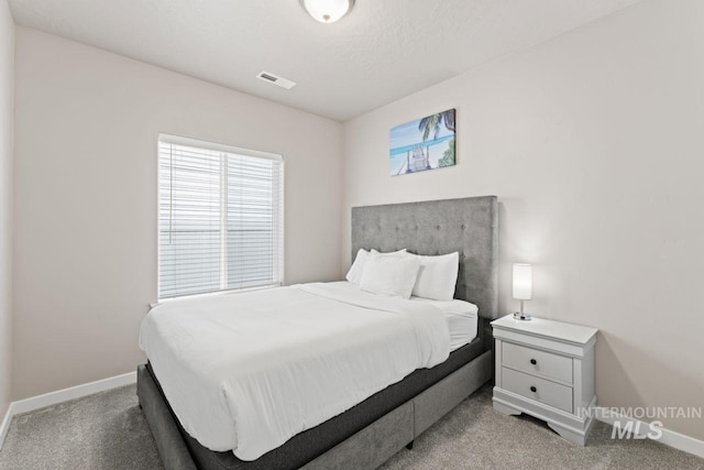 bedroom featuring carpet flooring, baseboards, and visible vents