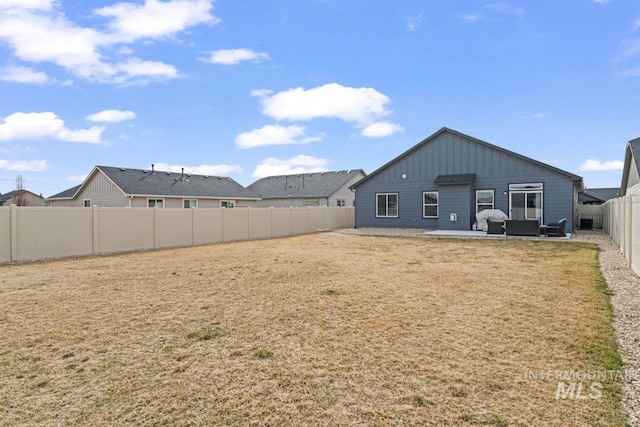 view of yard featuring a fenced backyard and a patio area