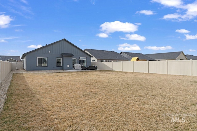 view of yard with a patio and a fenced backyard