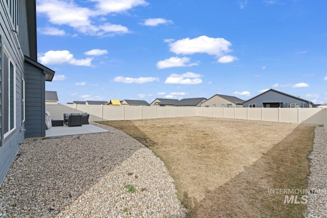 view of yard featuring a fenced backyard and a patio
