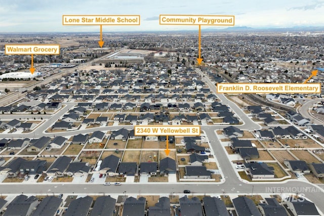 birds eye view of property with a residential view