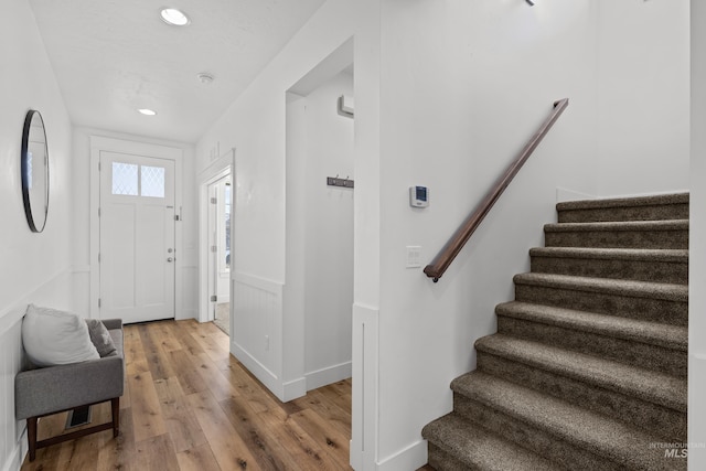 foyer entrance with hardwood / wood-style floors