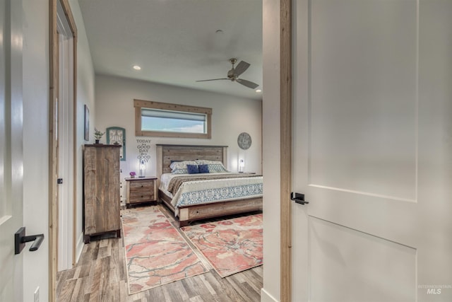 bedroom featuring a ceiling fan, recessed lighting, and wood finished floors
