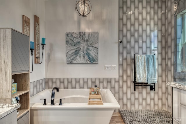 full bathroom with a tub