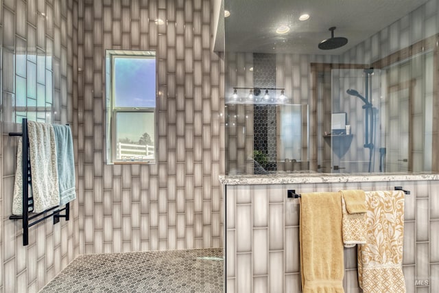 full bath with a tile shower