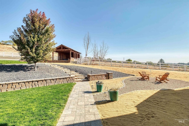 view of yard featuring an exterior structure and an outdoor structure