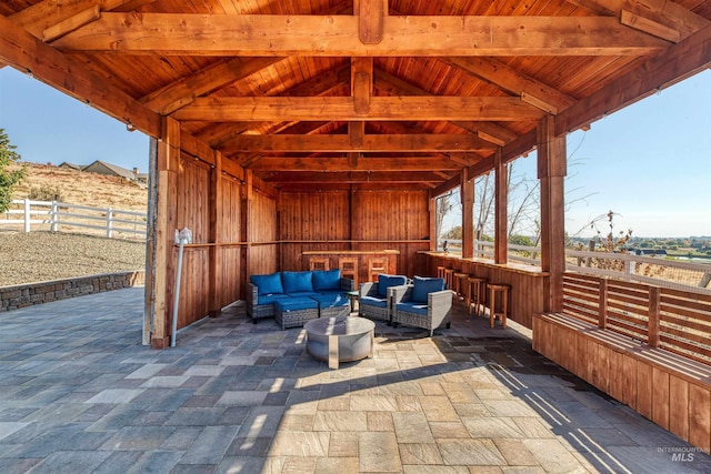 view of patio featuring an outdoor living space and fence