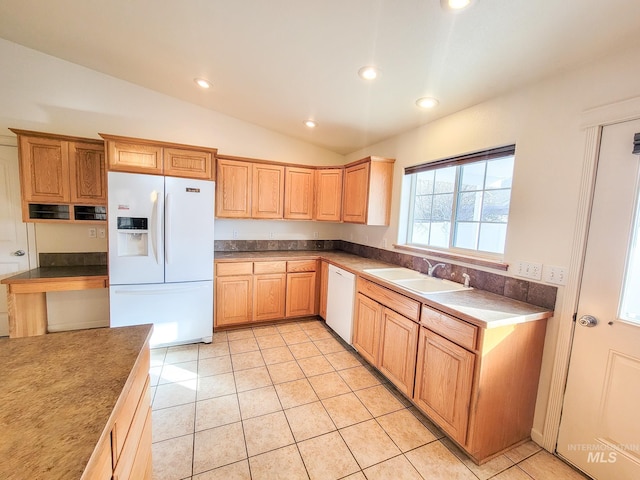 kitchen featuring light tile patterned floors, lofted ceiling, recessed lighting, a sink, and white appliances