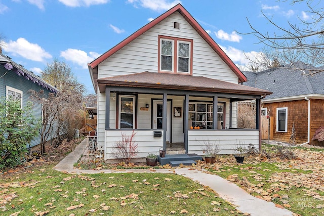 bungalow-style house with a front lawn