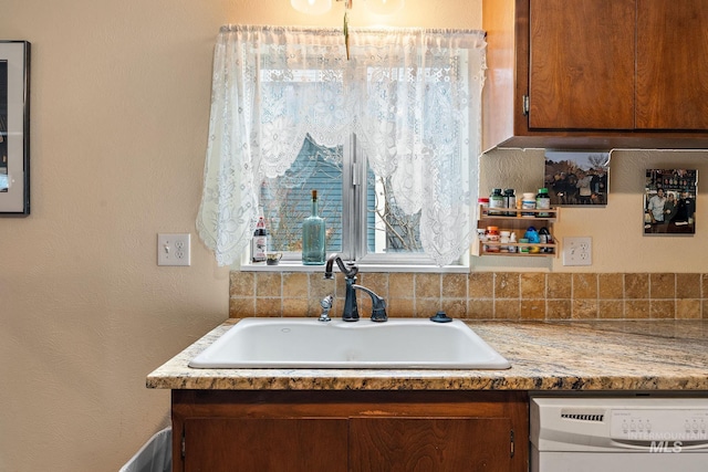 kitchen with dishwashing machine and sink