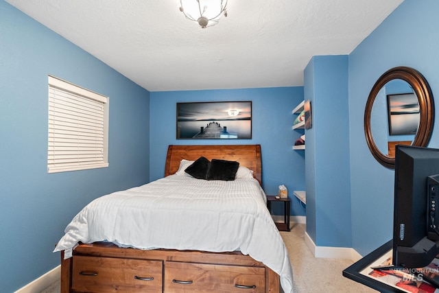 carpeted bedroom with a textured ceiling