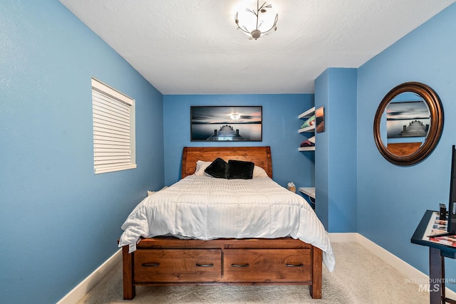 carpeted bedroom with a textured ceiling