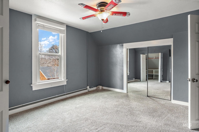 interior space with ceiling fan, lofted ceiling, and a closet