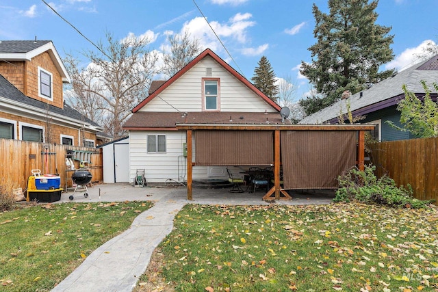 back of property featuring a patio area and a yard