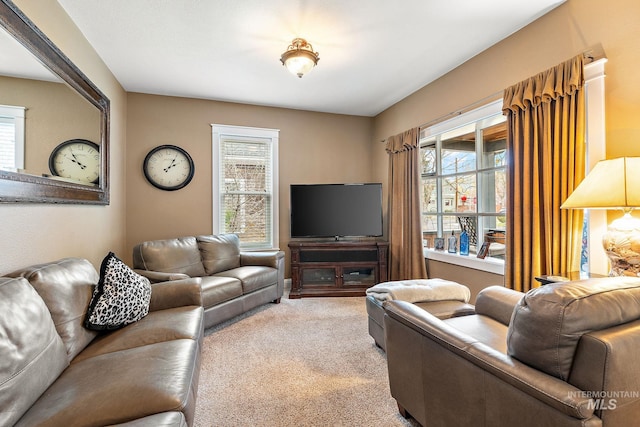 living room featuring light colored carpet and plenty of natural light