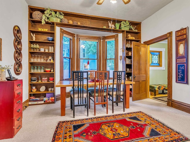 1408 N 7th St, Boise, ID 83702 - carpeted dining space featuring ceiling fan and baseboards