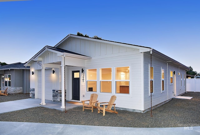 view of front of house featuring a garage, driveway, and board and batten siding