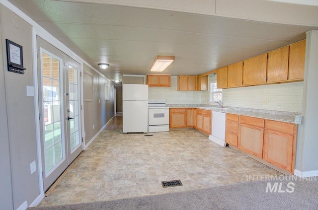 kitchen with decorative backsplash, french doors, white appliances, sink, and light brown cabinets