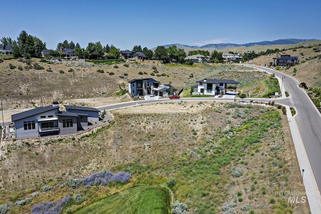 birds eye view of property with a mountain view