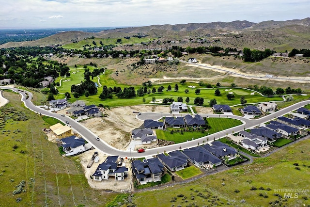 birds eye view of property featuring a mountain view