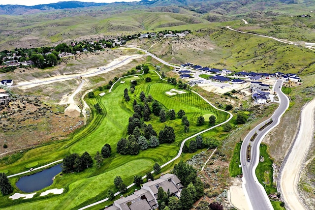 bird's eye view with a water and mountain view