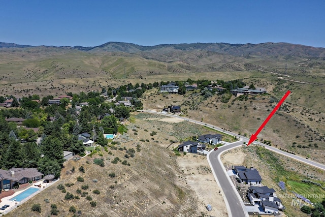 drone / aerial view featuring a mountain view