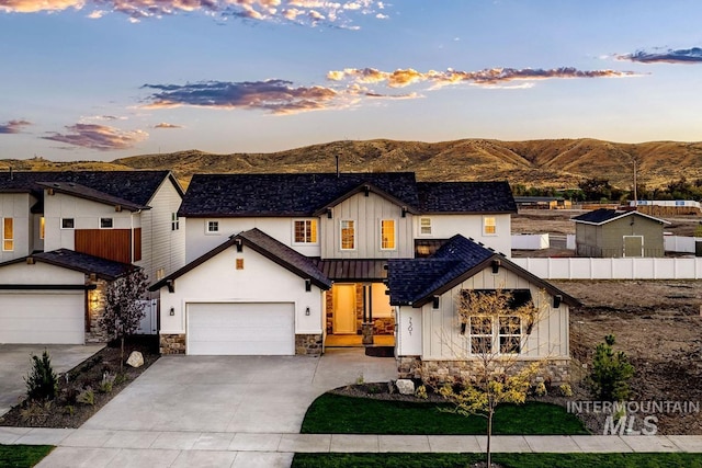 14241 N Woodpecker Ave, Boise, ID 83714 - modern inspired farmhouse with board and batten siding, stone siding, and a mountain view