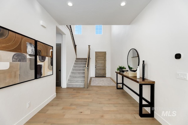 14241 N Woodpecker Ave, Boise, ID 83714 - corridor featuring stairway, baseboards, light wood-type flooring, and recessed lighting