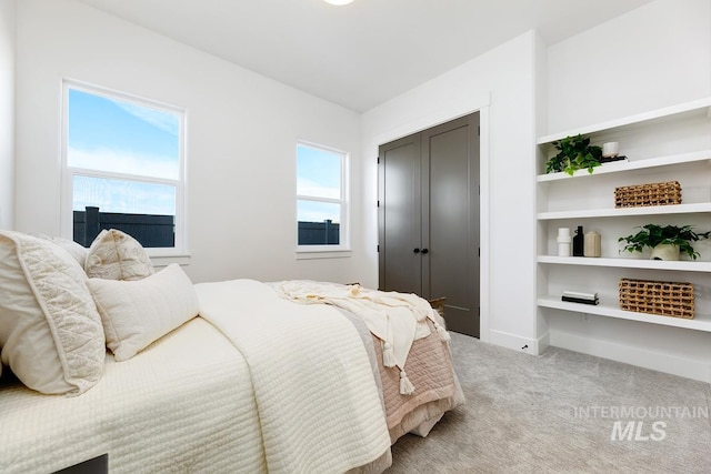 14241 N Woodpecker Ave, Boise, ID 83714 - bedroom featuring light colored carpet and baseboards