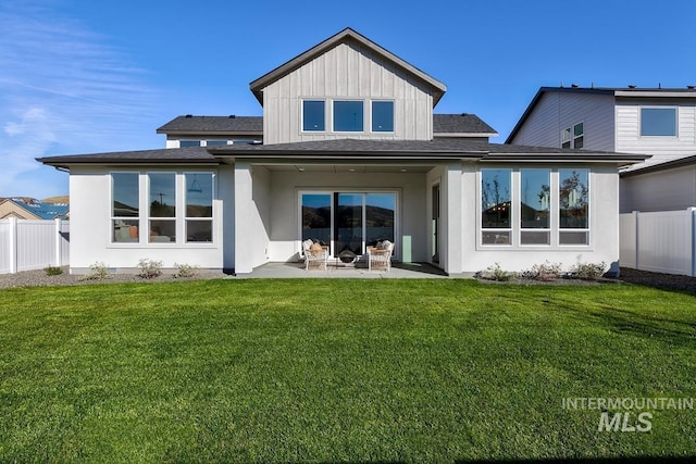 14241 N Woodpecker Ave, Boise, ID 83714 - back of house with a patio and board and batten siding