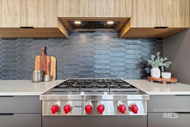 3501 E Planet Dr, Boise, ID 83712 - kitchen with backsplash, extractor fan, modern cabinets, light countertops, and gray cabinets