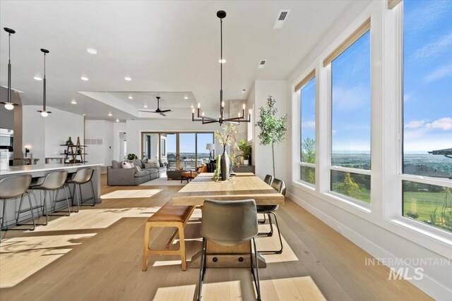 3501 E Planet Dr, Boise, ID 83712 - dining space featuring healthy amount of natural light, light wood-type flooring, a ceiling fan, baseboards, and recessed lighting