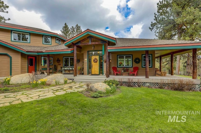 view of front of property with covered porch and a front yard