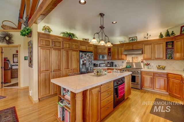 kitchen with pendant lighting, a chandelier, light hardwood / wood-style flooring, stainless steel appliances, and a center island