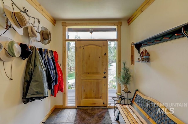 entryway with tile floors and a healthy amount of sunlight