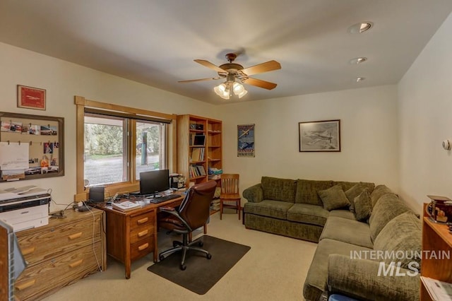 office with ceiling fan and light colored carpet