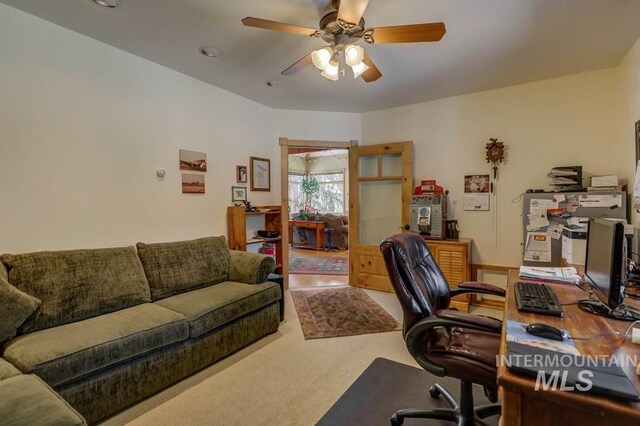 office space with carpet and ceiling fan