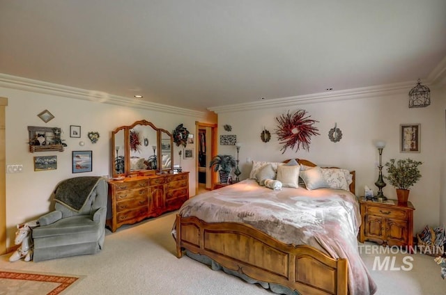 carpeted bedroom featuring ornamental molding