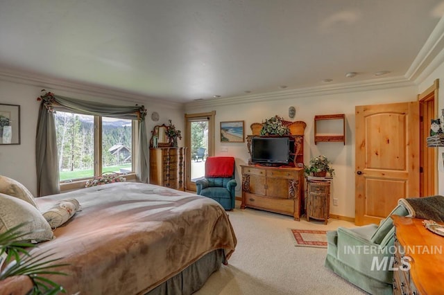 carpeted bedroom featuring crown molding