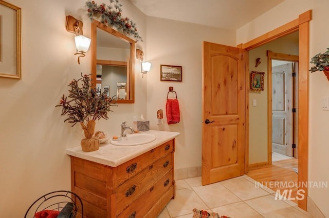 bathroom with hardwood / wood-style flooring and vanity