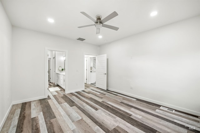 unfurnished bedroom with recessed lighting, visible vents, and wood finished floors