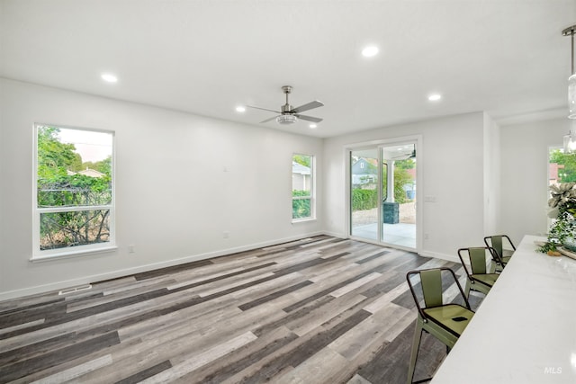 living area featuring a ceiling fan, wood finished floors, recessed lighting, and baseboards