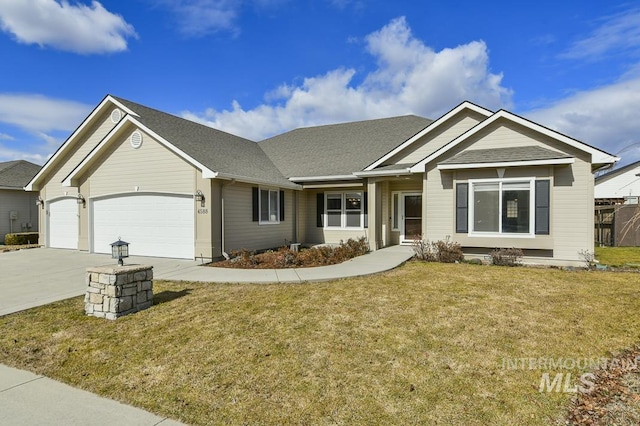 view of front of home featuring an attached garage, a front lawn, concrete driveway, and roof with shingles