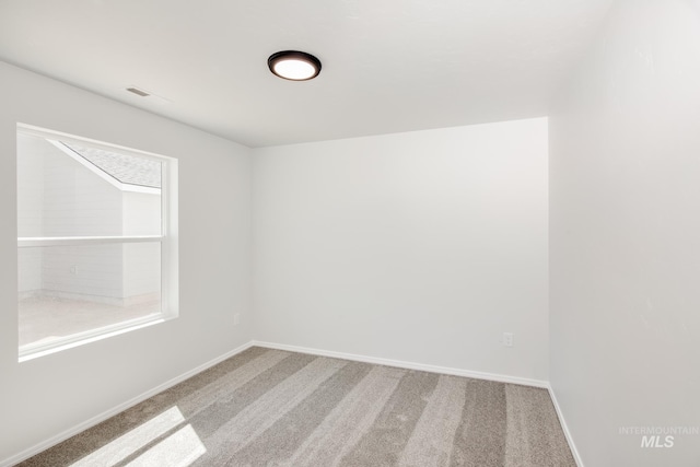 empty room featuring carpet flooring