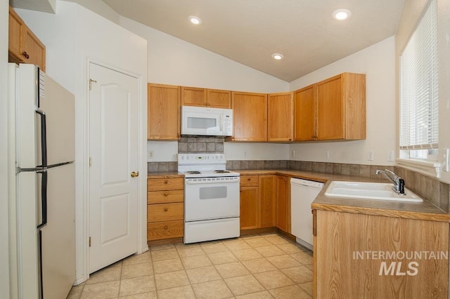 kitchen featuring white appliances, lofted ceiling, recessed lighting, a sink, and decorative backsplash