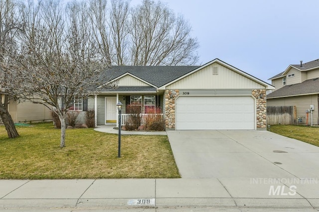 ranch-style home with fence, concrete driveway, a front yard, stone siding, and an attached garage