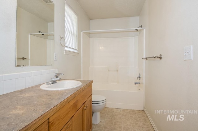 bathroom featuring vanity, toilet, and shower / bathtub combination