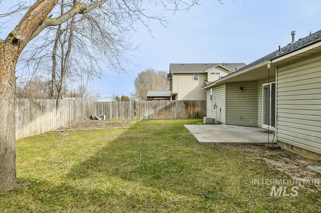 view of yard with a patio and a fenced backyard